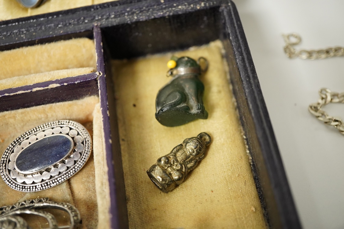 A group of mainly silver and white metal costume jewellery, including a moonstone set brooch, 53mm, a filigree gilt metal and enamel fob and marcasite set bracelet etc.